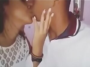 Indian boy kissing his girlfriend